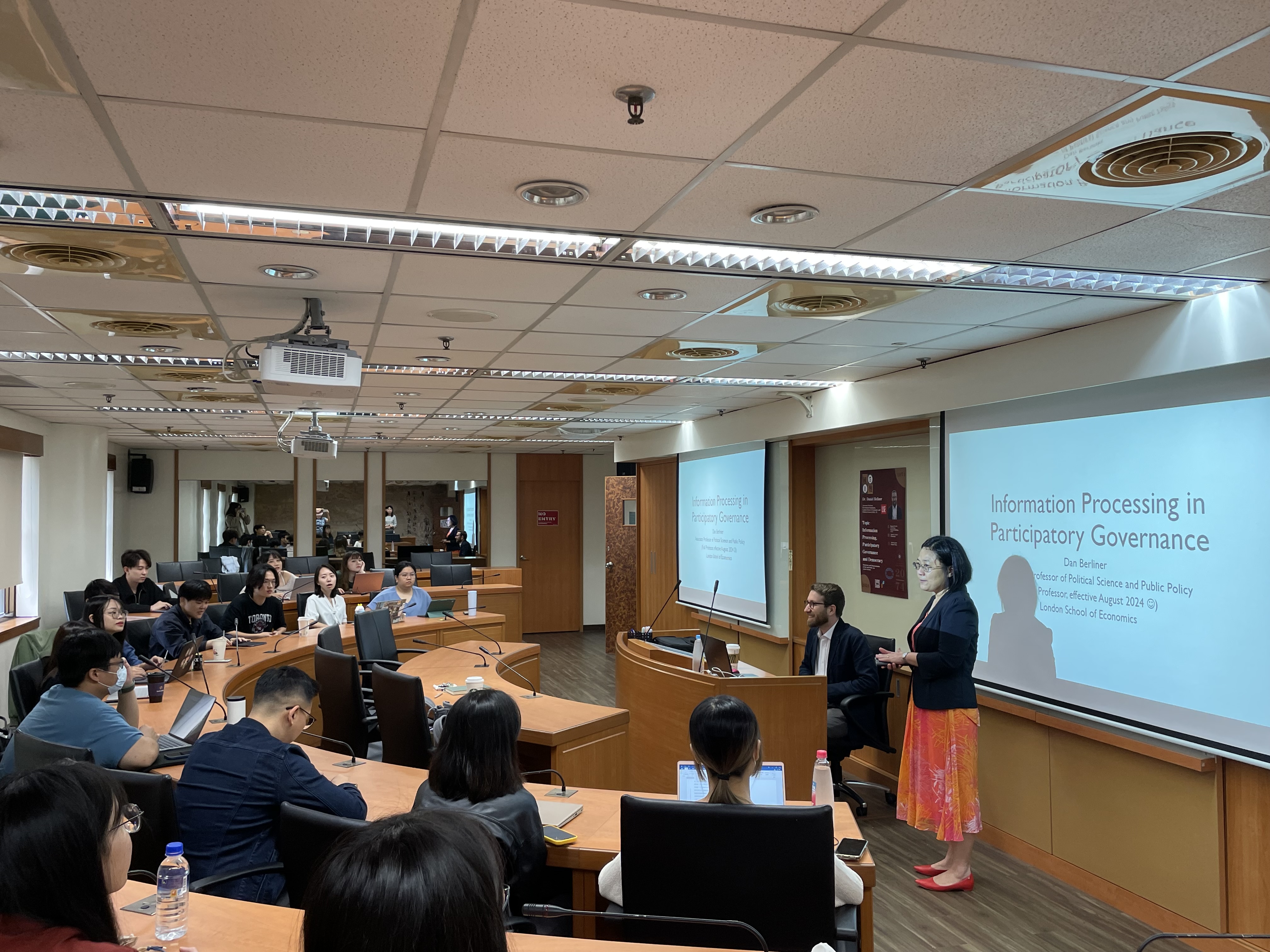 Faculty and students attentively listened to the lecture.